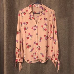 Floral patterned, button up shirt.